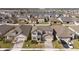 Two-story house, driveway, and neighborhood view at 1798 Flourish Ave, Kissimmee, FL 34744