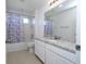 Bathroom with shower/tub combo and granite vanity at 1798 Flourish Ave, Kissimmee, FL 34744