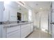 Bathroom with granite countertop and walk in shower at 1798 Flourish Ave, Kissimmee, FL 34744