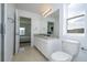 Clean bathroom with granite countertop and a toilet at 1798 Flourish Ave, Kissimmee, FL 34744