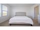 Spacious bedroom with a comfortable bed and large window at 1798 Flourish Ave, Kissimmee, FL 34744
