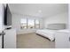 Bright bedroom with large window and dresser at 1798 Flourish Ave, Kissimmee, FL 34744