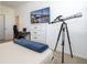 Bedroom with a telescope, dresser and large TV at 1798 Flourish Ave, Kissimmee, FL 34744