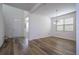 Bright dining room with wood-look floors and large window at 1798 Flourish Ave, Kissimmee, FL 34744