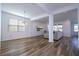 Open concept dining room with hardwood floors and large windows at 1798 Flourish Ave, Kissimmee, FL 34744