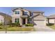 Two-story house with a two-car garage and landscaped front yard at 1798 Flourish Ave, Kissimmee, FL 34744