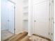 Clean hallway with built-in shelving and neutral color palette at 1798 Flourish Ave, Kissimmee, FL 34744