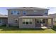 Two-story house with backyard patio and grill at 1798 Flourish Ave, Kissimmee, FL 34744