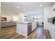 Open concept kitchen with island and breakfast bar at 1798 Flourish Ave, Kissimmee, FL 34744