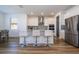 Modern kitchen island with seating for three at 1798 Flourish Ave, Kissimmee, FL 34744