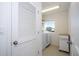 Bright laundry room with washer, dryer and storage at 1798 Flourish Ave, Kissimmee, FL 34744