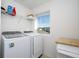 Well-lit laundry room with washer and dryer at 1798 Flourish Ave, Kissimmee, FL 34744