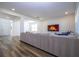 Open living room with sectional sofa and hardwood floors at 1798 Flourish Ave, Kissimmee, FL 34744