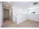 Bright loft area with carpet, hallway and stairs at 1798 Flourish Ave, Kissimmee, FL 34744