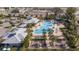Community pool with lounge chairs and cabanas at 1798 Flourish Ave, Kissimmee, FL 34744