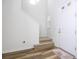 Modern staircase with carpeted steps and wood-look flooring at 1798 Flourish Ave, Kissimmee, FL 34744
