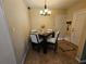 Cozy dining area with a square table and four chairs at 206 Cooke St, Leesburg, FL 34748