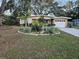 Ranch style home with landscaped yard and attached garage at 206 Cooke St, Leesburg, FL 34748