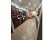 Kitchen with dark wood cabinets and tile flooring at 206 Cooke St, Leesburg, FL 34748