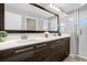 Double vanity, large mirror, and walk-in shower at 218 Brooke'S Pl, Haines City, FL 33844