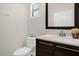 Updated bathroom with dark wood vanity and a modern sink at 218 Brooke'S Pl, Haines City, FL 33844