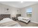 Two twin beds, nightstand, and window with blinds in a well-lit bedroom at 218 Brooke'S Pl, Haines City, FL 33844