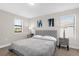King-size bed, nightstands, and windows in a spacious bedroom at 218 Brooke'S Pl, Haines City, FL 33844