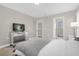 Bright bedroom with mirrored furniture and a view of the backyard at 218 Brooke'S Pl, Haines City, FL 33844