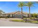 Community clubhouse with palm trees and welcoming entrance at 218 Brooke'S Pl, Haines City, FL 33844