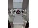 Dining room with glass table, white chairs, and place settings at 218 Brooke'S Pl, Haines City, FL 33844