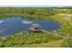 Scenic gazebo on a lake with wooden walkway at 218 Brooke'S Pl, Haines City, FL 33844