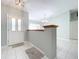 Bright and airy entryway with tile flooring and modern light fixture at 23917 Kays Way, Astatula, FL 34705