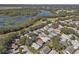 Aerial view of homes and lake at 24946 Cranes Roost Circle, Leesburg, FL 34748