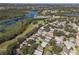 Aerial view showing two homes near community pool at 24946 Cranes Roost Circle, Leesburg, FL 34748