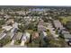 Aerial view of neighborhood near golf course and lake at 24946 Cranes Roost Circle, Leesburg, FL 34748