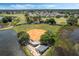 Community baseball field near a pond at 24946 Cranes Roost Circle, Leesburg, FL 34748