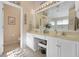 Double vanity bathroom with a separate toilet and shower at 24946 Cranes Roost Circle, Leesburg, FL 34748