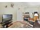 Bright bonus room features built-in workspace and comfortable seating at 24946 Cranes Roost Circle, Leesburg, FL 34748