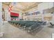 Large community hall with stage and seating at 24946 Cranes Roost Circle, Leesburg, FL 34748