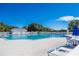 Relaxing community pool with lounge chairs at 24946 Cranes Roost Circle, Leesburg, FL 34748