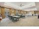 Spacious community room with tables and chairs, perfect for gatherings at 24946 Cranes Roost Circle, Leesburg, FL 34748