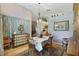 Dining room with a table, chairs, and built-in hutch at 24946 Cranes Roost Circle, Leesburg, FL 34748