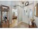 Bright entryway with hardwood floors and access to living room at 24946 Cranes Roost Circle, Leesburg, FL 34748