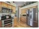 Kitchen features stainless steel appliances and wood cabinets at 24946 Cranes Roost Circle, Leesburg, FL 34748