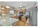 Modern kitchen with stainless steel appliances and an island at 24946 Cranes Roost Circle, Leesburg, FL 34748