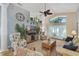 Spacious living room with vaulted ceiling, hardwood floors, and comfy seating at 24946 Cranes Roost Circle, Leesburg, FL 34748
