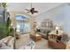 Spacious living room with vaulted ceiling, hardwood floors, and comfy seating at 24946 Cranes Roost Circle, Leesburg, FL 34748