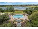 Resort-style pool with a spa and a surrounding patio at 24946 Cranes Roost Circle, Leesburg, FL 34748