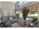 Relaxing sunroom with comfy seating and view of backyard at 24946 Cranes Roost Circle, Leesburg, FL 34748