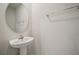 Simple bathroom with pedestal sink and oval mirror at 251 Blueberry Ln, Davenport, FL 33837